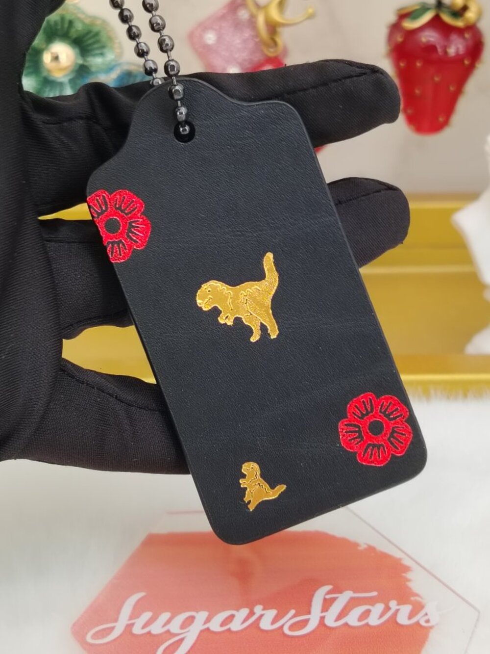 Coach black dinosaur tag bag charm